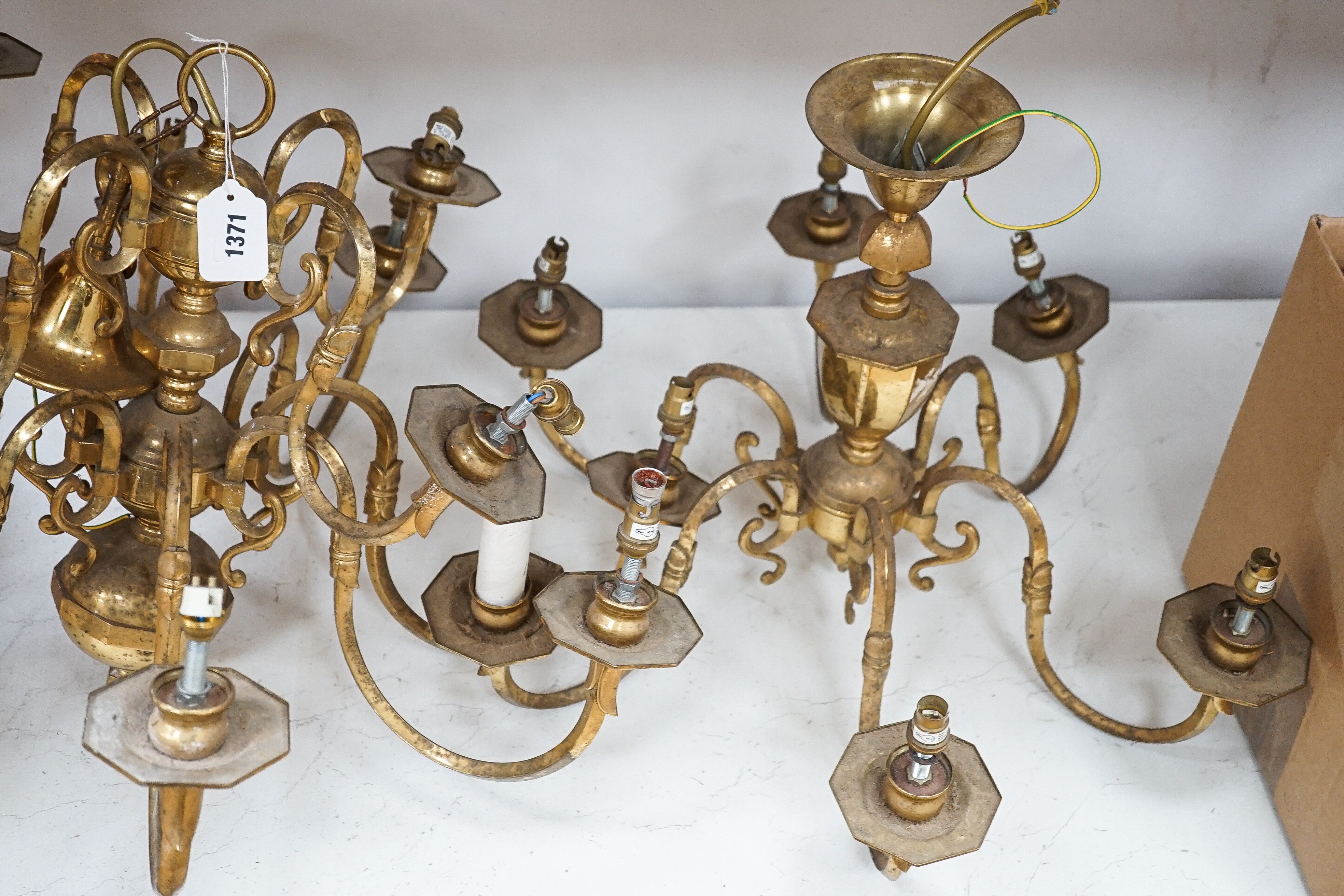 A brass two tier twelve branch electrolier and an associated six branch electrolier, 12 branch 46 cms high.